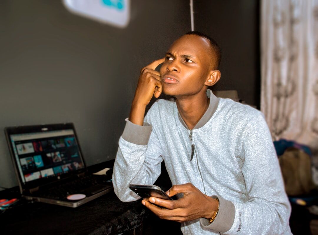 african entrepreneur using mobile phone