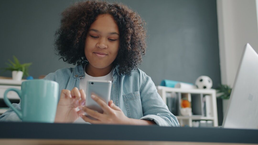 african woman using smartphone for banking