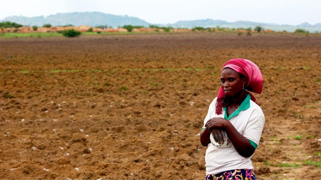 african farmer checking phone