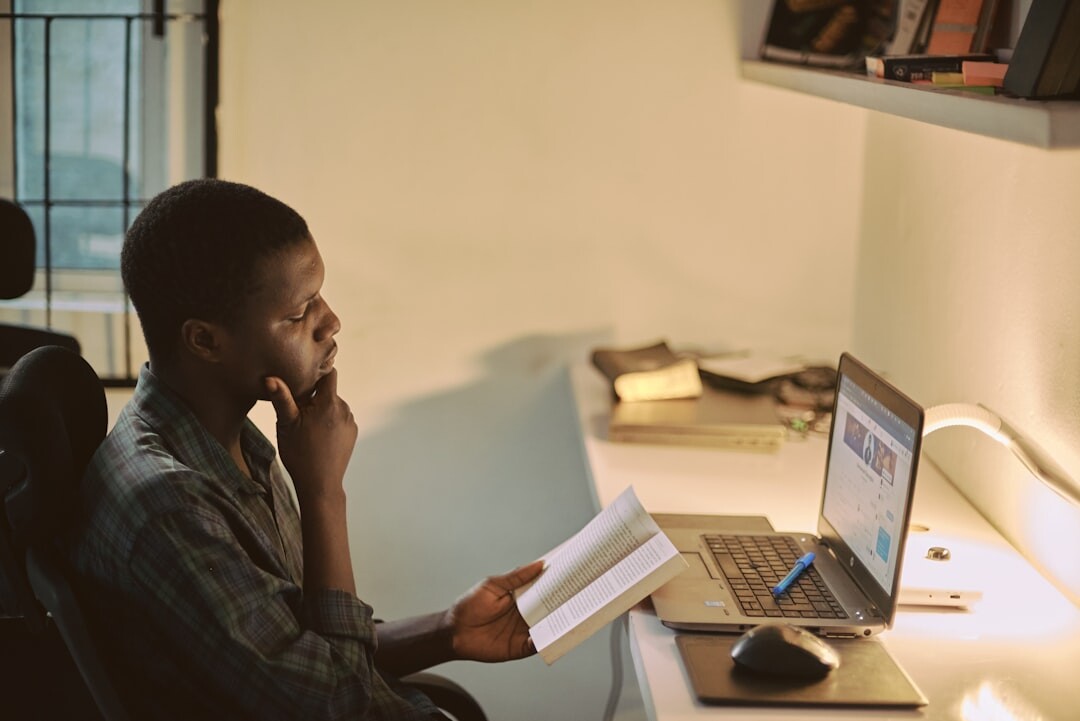 african youth using laptop